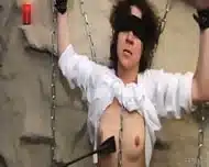 Blindfolded Brunette In White Shirt Is Bonded To Wall And Whipped By Hooded Monk